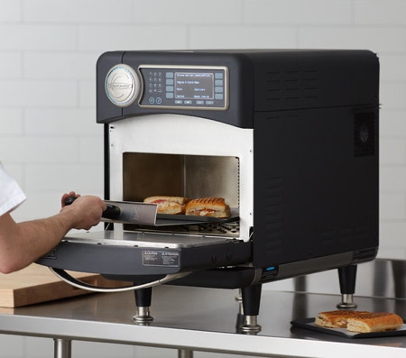 Commercial Kitchen Equipment Repair Service - Professional technician servicing commercial kitchen equipment in Seattle restaurant